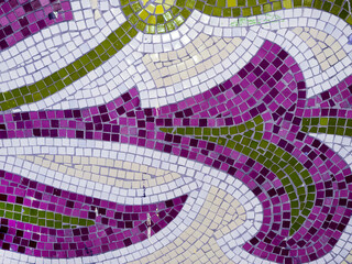 Detail of beautiful old collapsing abstract ceramic mosaic adorned building. Venetian mosaic as decorative background. Selective focus. Abstract Pattern. Abstract mosaic colored ceramic stones