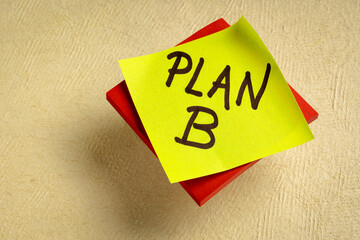 plan B - handwriting on a reminder note, change of business or personal plans and goals