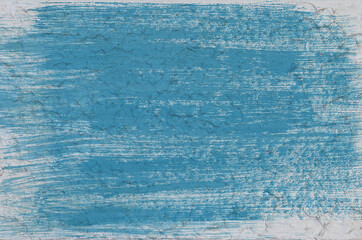 Pared de concreto pintada de azul. Patr&oacute;n de brocha visible.