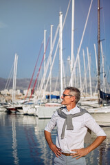 Fototapeta premium Portrait of senior on the marina