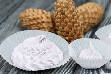 Zephyr  and spruce cones. On painted pine planks.