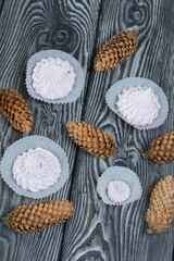 Zephyr  and spruce cones. On painted pine planks.