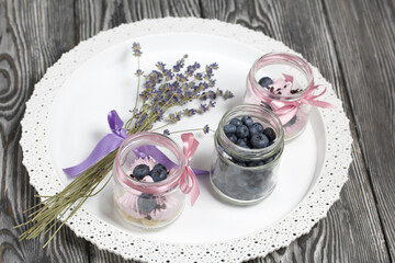 Zephyr in a jar, decorated with blueberries and a bouquet of lavender. On a tray.