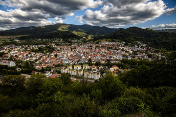 Fototapeta na wymiar Panoramic view of the town Waldkirch and the Kandel summit in the background, Black Forest mountains, Germany, seen from the castle 