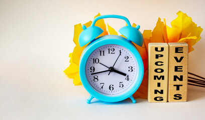 FOREIGN word with wooden blocks concept with clock and yellow foliage on white background