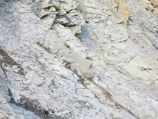 textured background of rock structure. Caucasus Mountains