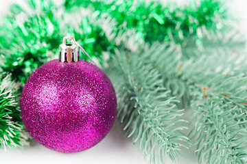 Obraz na płótnie Canvas Purple christmas, new year ball photne spruce branch, selective focus, bokeh