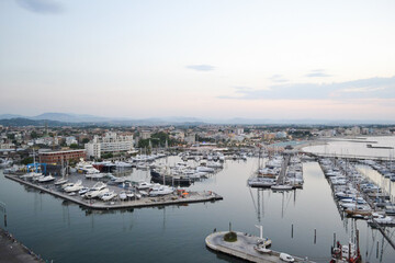 yachts on the pier, sea coast, evening panorama of the sea.  a small town by the sea.  sunset over the sea. many boats in the port