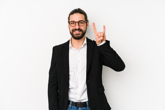 Young caucasian business man isolated on a white background showing a horns gesture as a revolution concept.