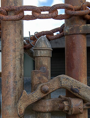 Rusty old chain securing a gate, closeup