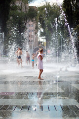 Summer. Dry Fountain. The girl bathes in the fountain.