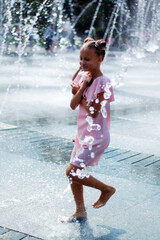 Girl bathes in a fountain