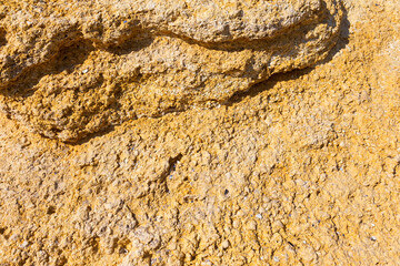 background natural not processed yellow stone shell.