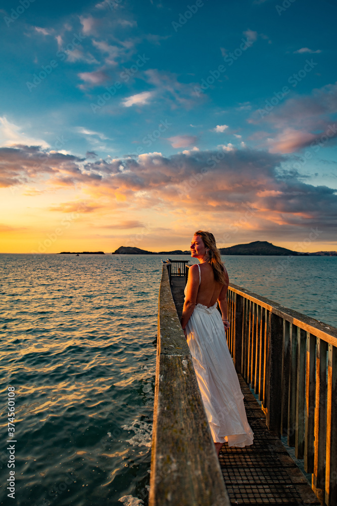 Wall mural woman on the pier