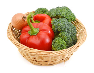 Broccoli , onion and red peppers in basket on white