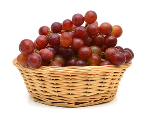 red grapes in basket on white background