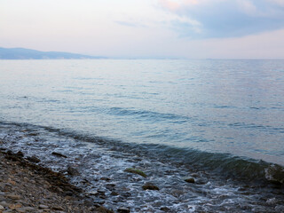 Obraz premium In fog disappears fantastic beautiful sea landscape with view of horizon of silhouette of urban buildings and high-rise buildings off coast of Novorossiysk, Russia. Minimalism. Image shows good grain 