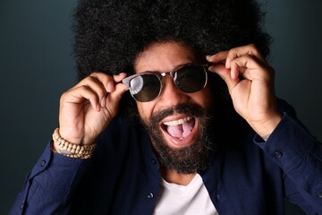 Beautiful afro man in front of a colored background