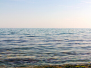 Background of sea water. Bright, saturated green sea surface as a background for any your project