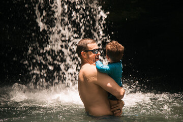Puerto rico food and sites old san juan man with his son at a waterfall 