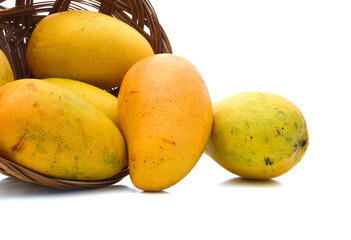 Fresh mango fruits isolated in basket on white background