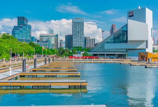 The Cleveland Ohio skyline stands  behind the Lake Erie marina.