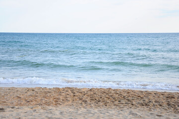 Seawater and blue sky and sand beach background. Without people copy space. Summer day.