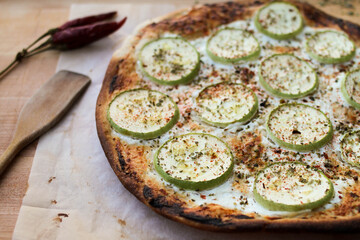 Zucchini Pizza: Pizza with zucchini, sour cream, and cheese, sprinkled with dried oregano and ground hot pepper. Vegetarian pizza.