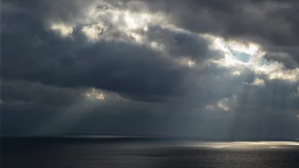 Fotobehang storm clouds over the sea © Maksim