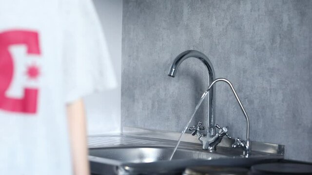 water runs from two taps in the kitchen