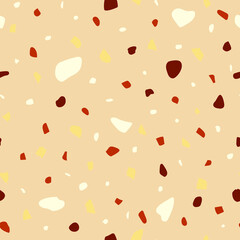 Seamless pattern in beige colors. Nut crumb, mosaic and terrazzo texture. Can be used for decor, textiles, fabrics, packaging, wrapping paper, wallpaper, design, printing.