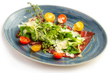 Veal carpaccio with arugula, parmesan and cherry tomatoes