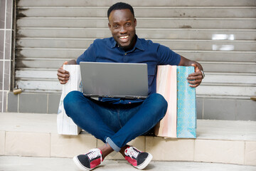 portrait of a young man after happy shopping.