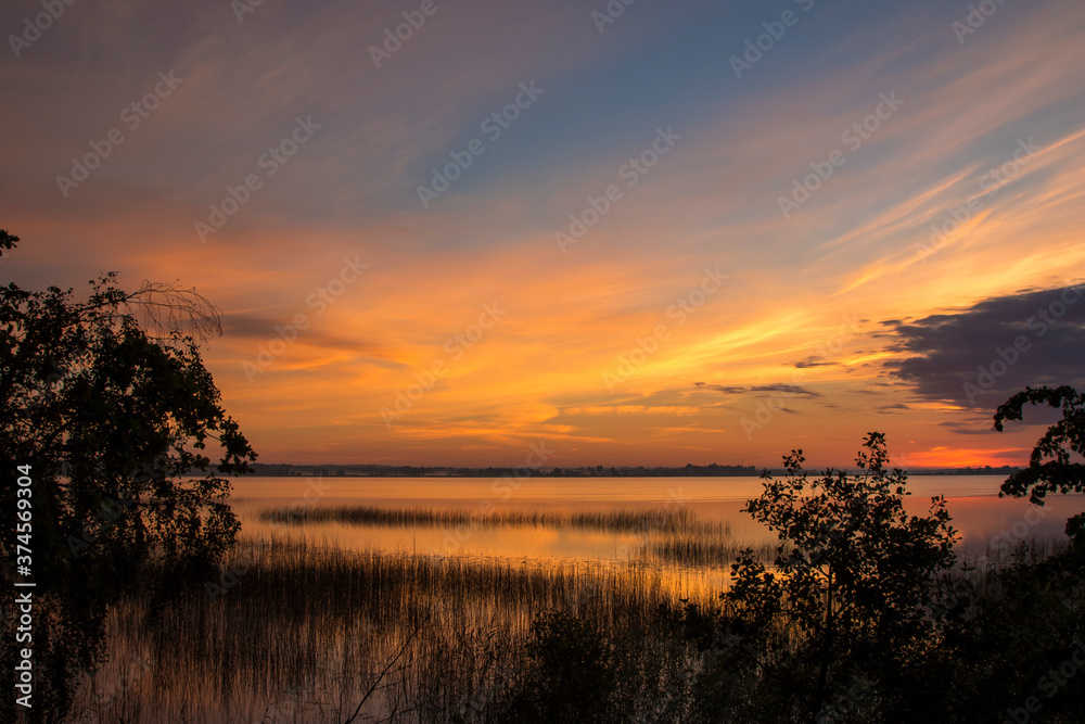 Wall mural Summer lake at dawn, nature background.