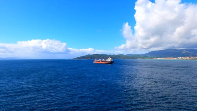 One tanker carrier stay at anchor and another balk carrier going to anchor at Gibraltar Bay