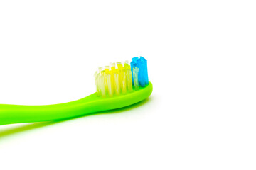 White background on it toothbrushes of different colors are arranged in a chaotic manner oral hygiene isolate, brushing teeth