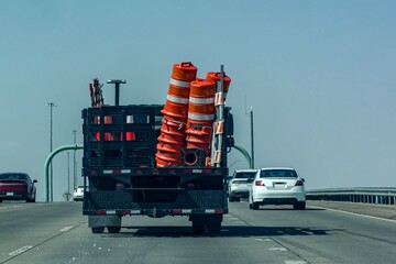 The construction vehicle on Hwy 54 with other vehicles.