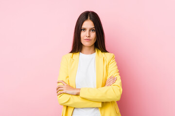 Fototapeta premium Young business woman unhappy looking in camera with sarcastic expression.