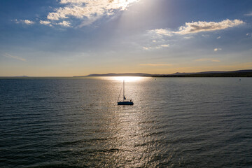 Fototapeta premium Sailing boat is waiting for the sunset on the lake Balaton