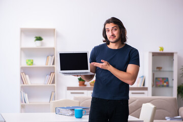 Young man employee working from house