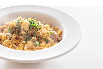 Fried instant noodle with egg and pork
