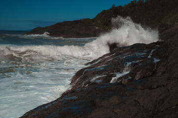 waves breaking on rocks