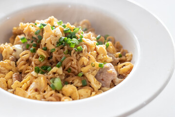 Fried instant noodle with egg and pork