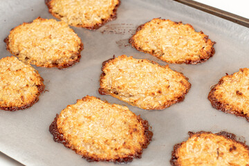 Coconut and banana cookies preparation drizzled with melted chocolate. Baking