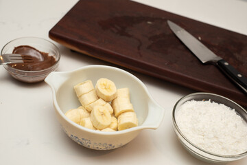 Coconut and banana cookies preparation drizzled with melted chocolate. Preparation