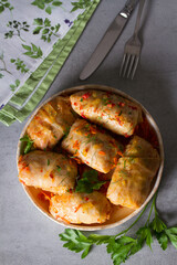 Stuffed cabbage leaves with meat, rice and vegetables. Chou farci, dolma, sarma, sarmale, golubtsy or golabki - popular dish in many countries. View from above, top studio shot