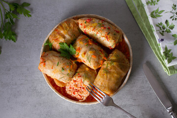 Stuffed cabbage leaves with meat, rice and vegetables. Chou farci, dolma, sarma, sarmale, golubtsy or golabki - popular dish in many countries. View from above, top studio shot