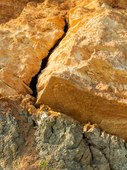 Desert landscape with multi-colored yellow, green and blue clay deposits of minerals in geological formations