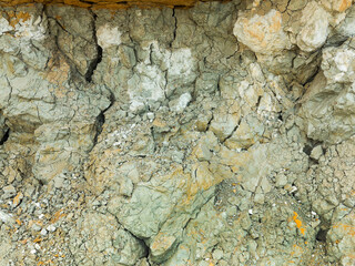 Desert landscape with multi-colored yellow, green and blue clay deposits of minerals in geological formations