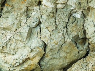 Desert landscape with multi-colored yellow, green and blue clay deposits of minerals in geological formations